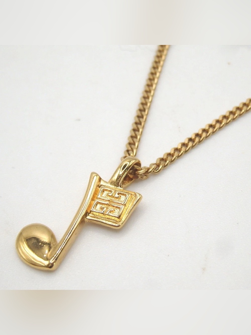 GIVENCHY Gold Tone Musical Note Pendant Necklace
